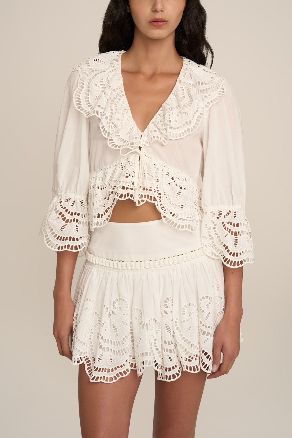 Poupette St Barth Blouse Casta in natural white, plain style, displayed on a mannequin with a mini skirt, front view image.