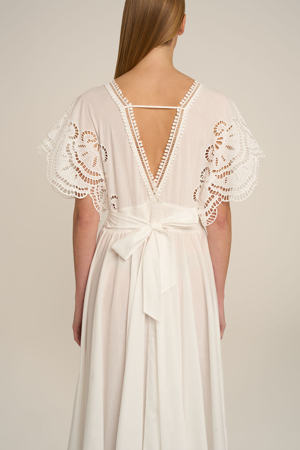 Natural white Kaftan Hina by Poupette St Barth, flowing fabric with a relaxed fit, displayed on a mannequin.
