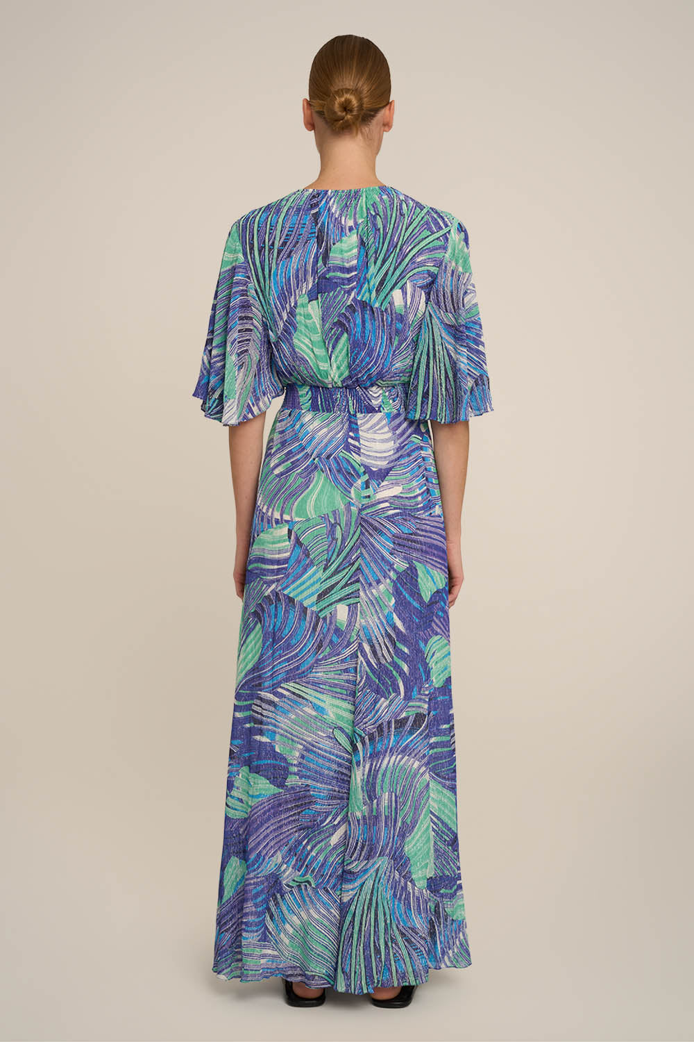 Blue long dress Grace by Poupette St Barth, shown from the back with flowing fabric and elegant design.