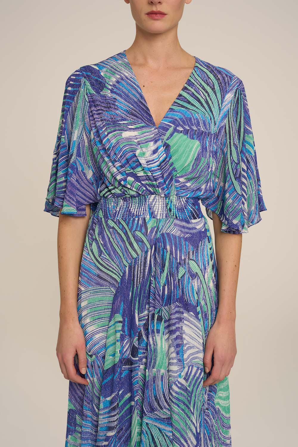 Blue Long Dress Grace by Poupette St Barth featuring flowing fabric and elegant design, shown on a model.