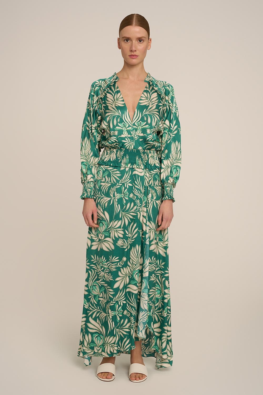 Green Kelly Long Dress by Poupette St Barth, featuring a flowing silhouette and elegant design, shown from the front.