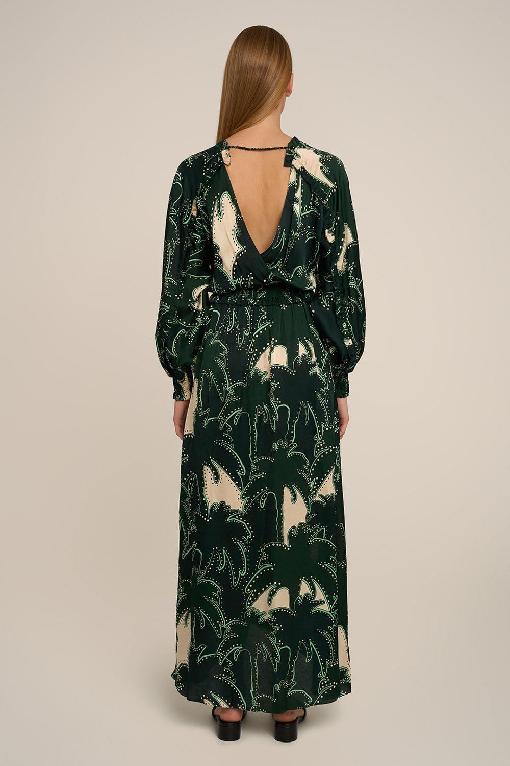 Back view of Poupette St Barth Kelly long dress in green Palmae, flowing fabric with a relaxed fit and elegant design.