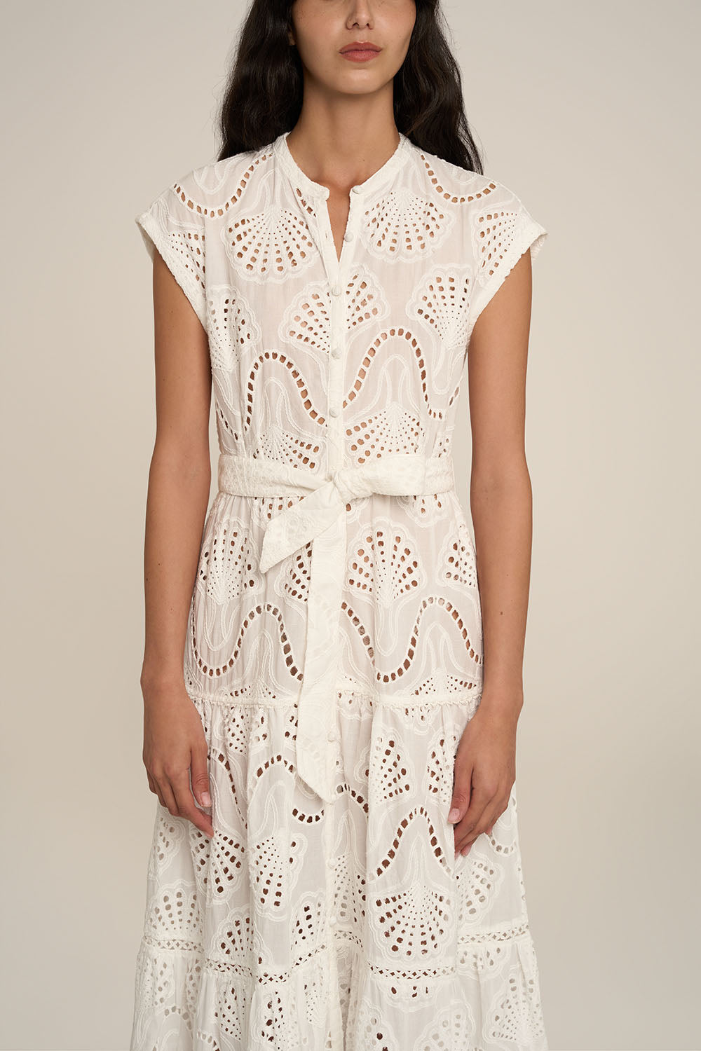 Long white Kora long dress by Poupette St Barth, featuring flowing fabric and elegant design.