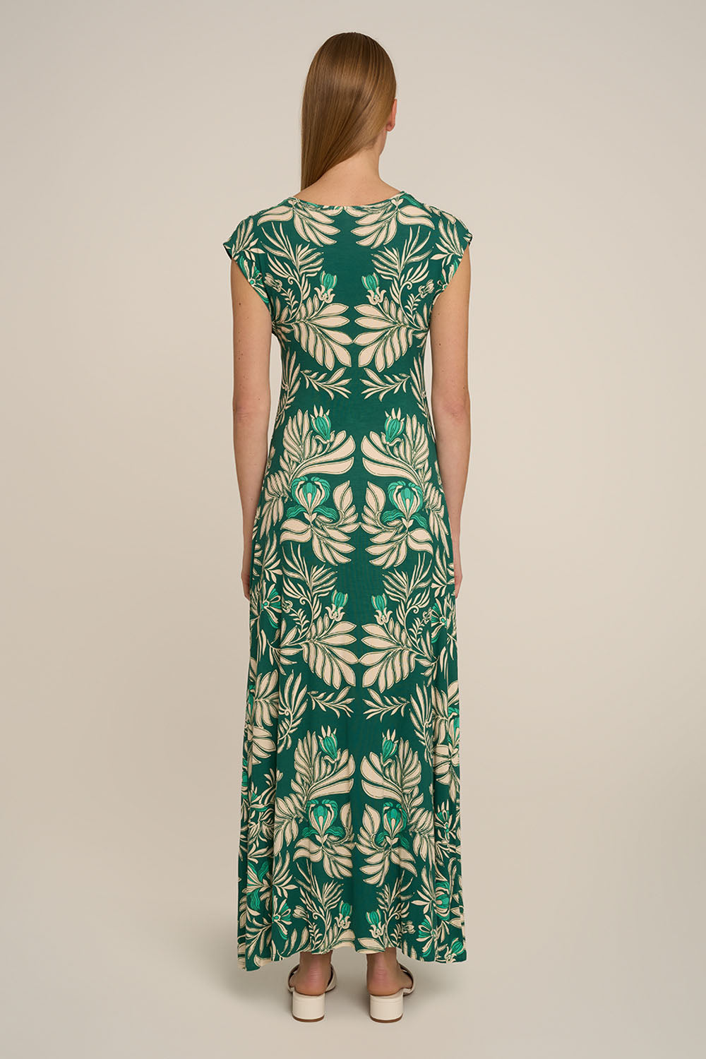 Green Kerylos Long Dress by Poupette St Barth, showcasing flowing fabric and elegant back design.