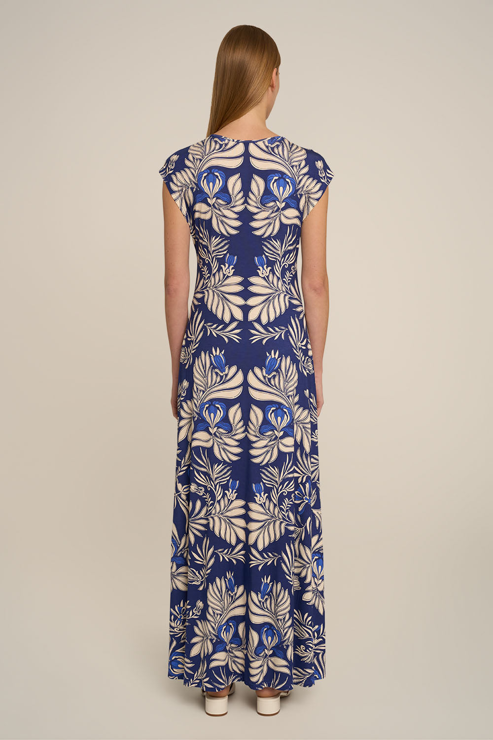 Navy long dress from Poupette St Barth's Long Dress Nova collection, showing back view with flowing fabric and elegant design.