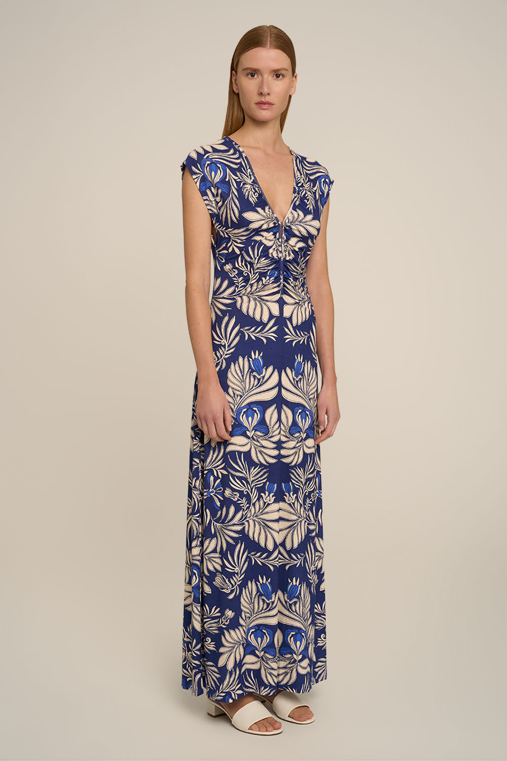 Navy Poupette St Barth Long Dress Nova with flowing silhouette and elegant design, shown from side view.