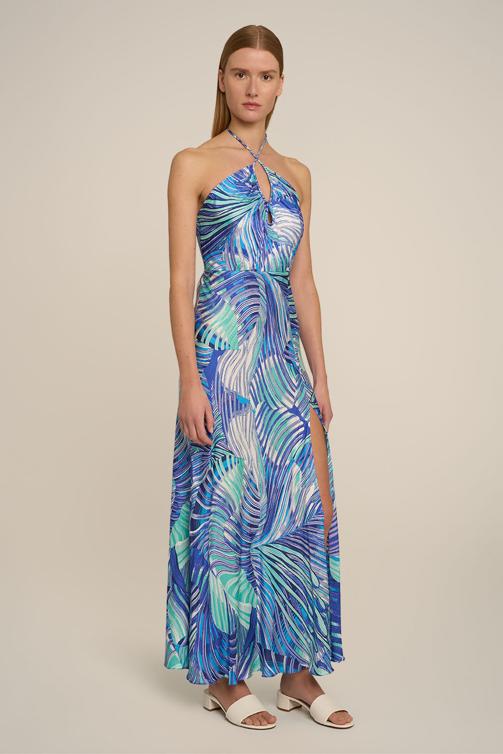Blue Stella long dress by Poupette St Barth, elegant flowing fabric and side view showcasing stylish design details.