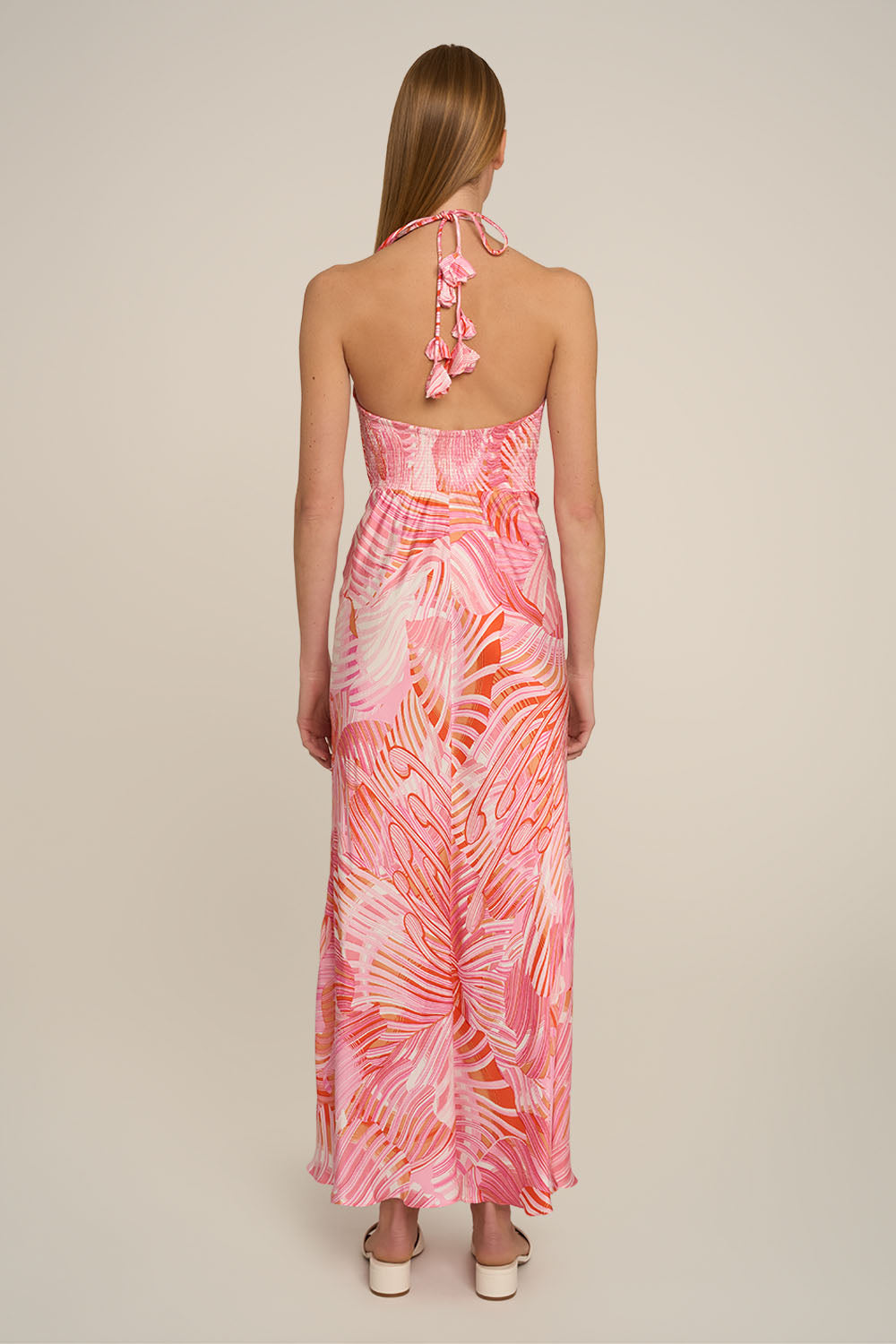 Pink Stella long dress by Poupette St Barth, with flowing fabric and elegant design, shown from the back.
