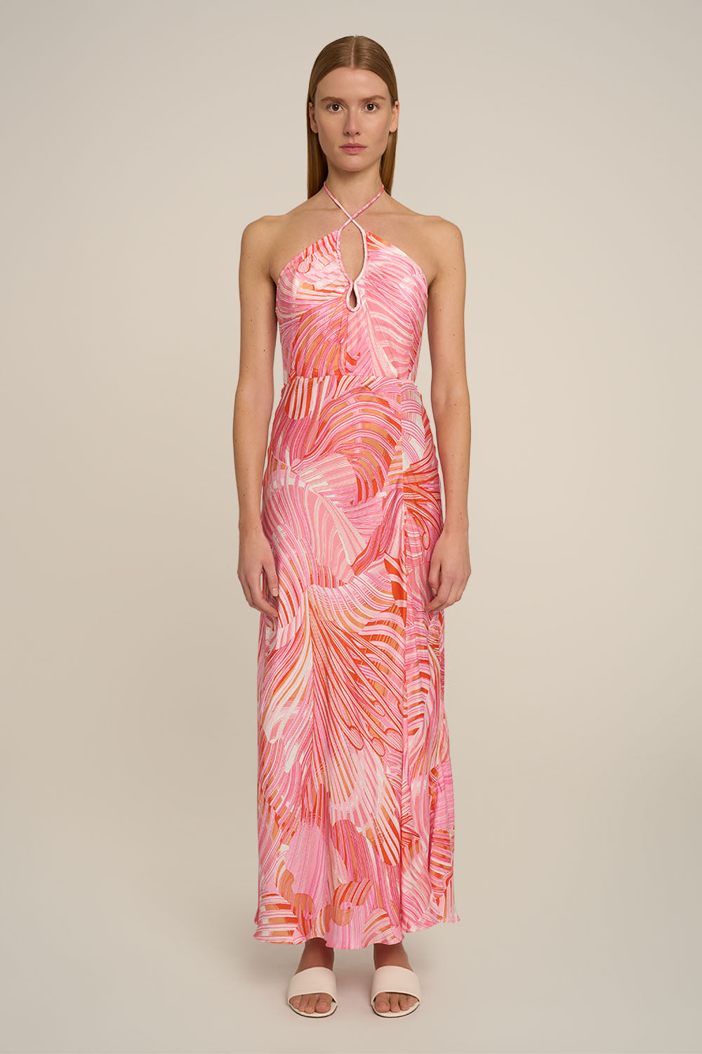 Pink Stella long dress by Poupette St Barth featuring flowing fabric and elegant design, shown from the front.