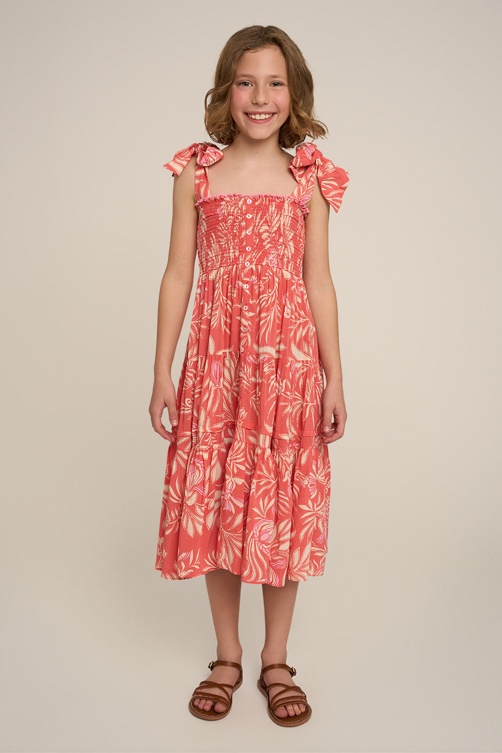 Pink long girl’s dress from Poupette St Barth’s Triny collection, featuring a flowing design and elegant style.