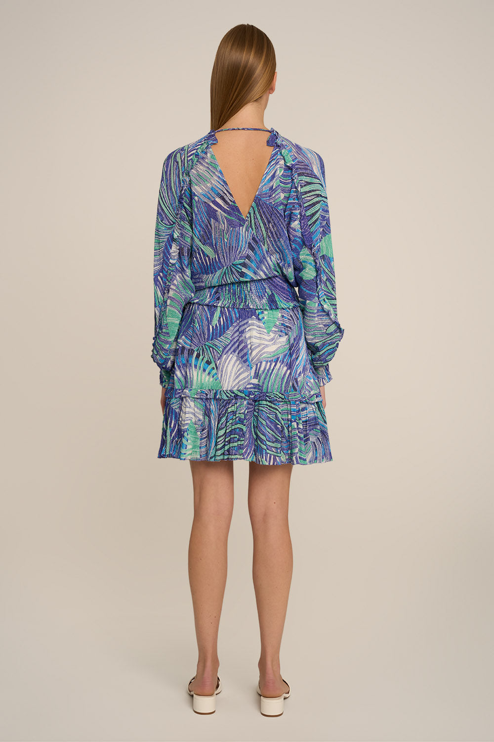 Blue Althea Mini Dress by Poupette St Barth, showing the back view with flowing fabric and stylish design details.