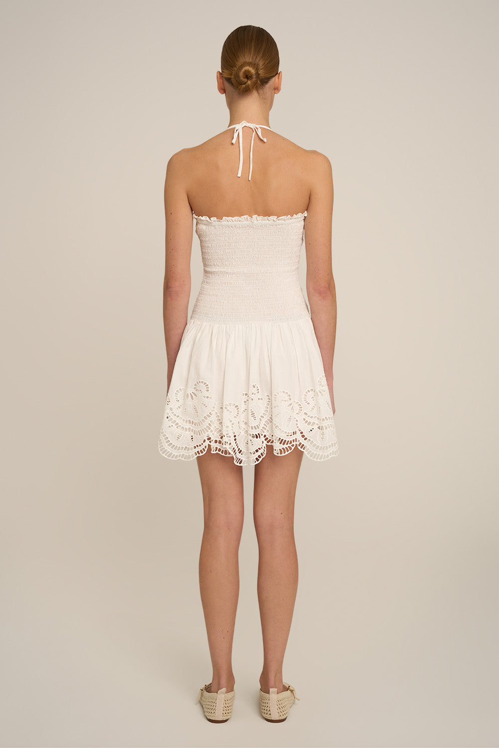 Natural white Mini Dress Circe by Poupette St Barth, back view showing lightweight fabric and elegant design.