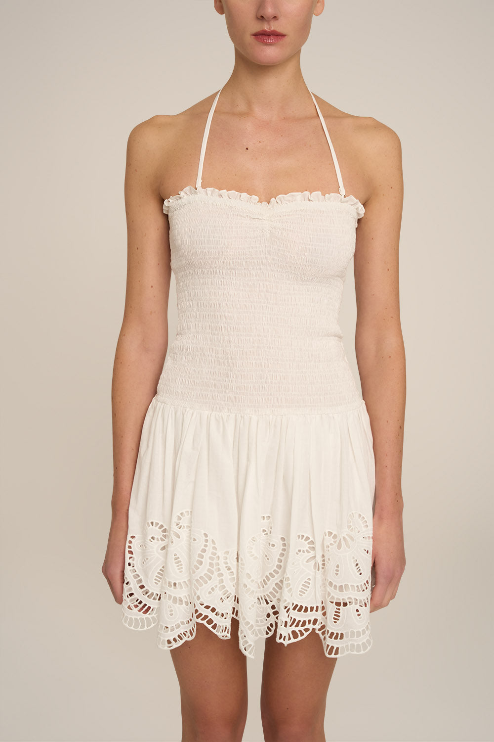 Poupette St Barth Mini Dress Circe in natural white fabric, showcasing a stylish sleeveless design and elegant fit.