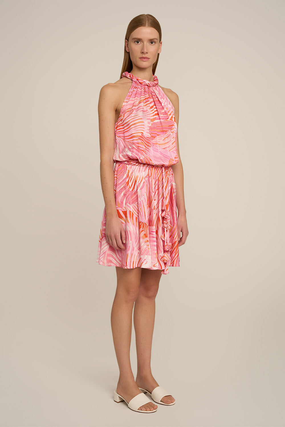 Pink Mini Dress Jade by Poupette St Barth, shown from the side with a flowy, lightweight fabric and stylish design.