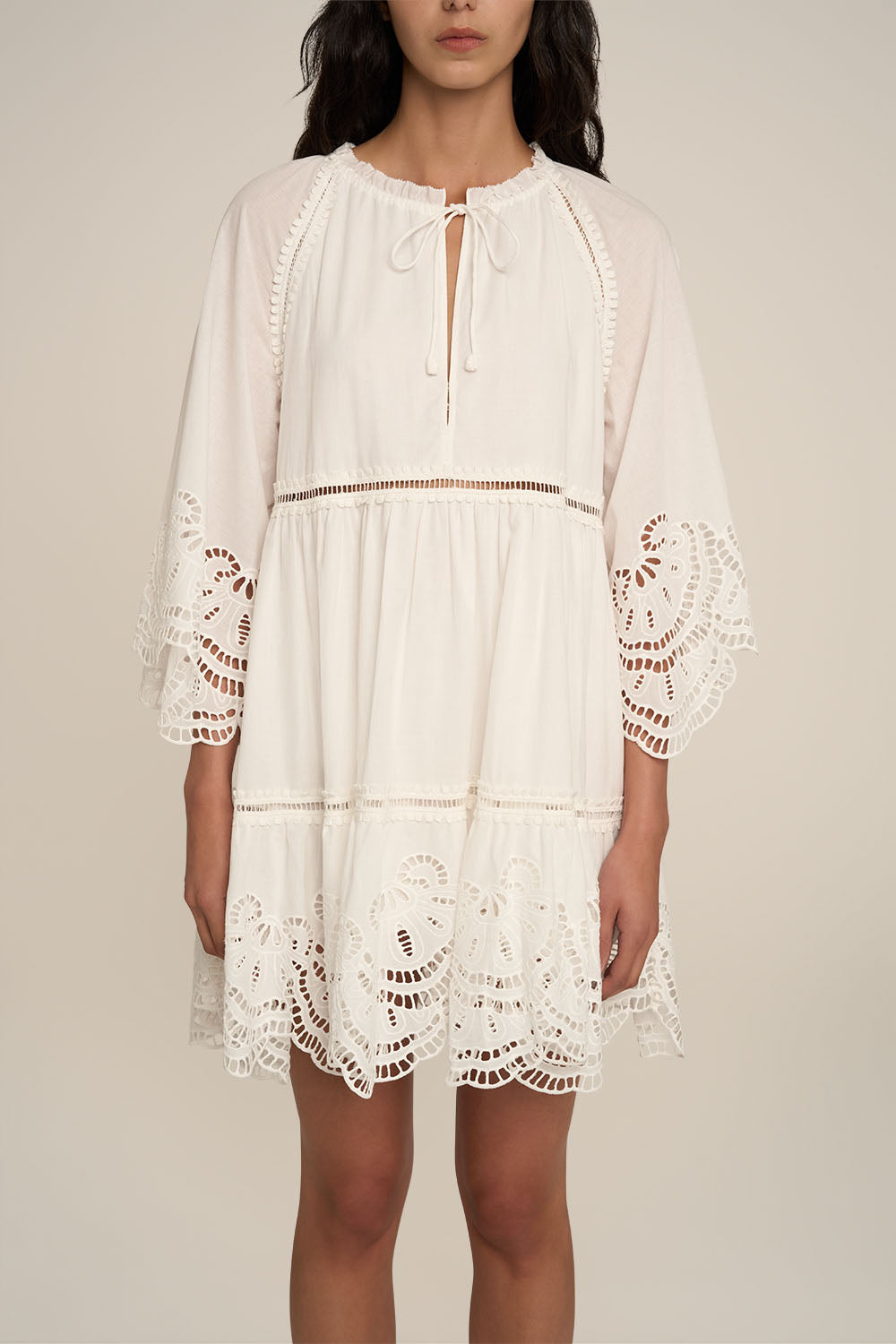 Natural white Mini Dress Mona by Poupette St Barth, sleeveless with a fitted silhouette, shown on a model.