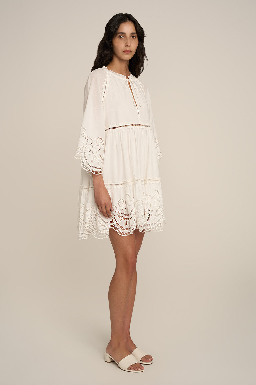Natural white Mini Dress Mona by Poupette St Barth, shown from the side with a fitted silhouette and sleeveless design.