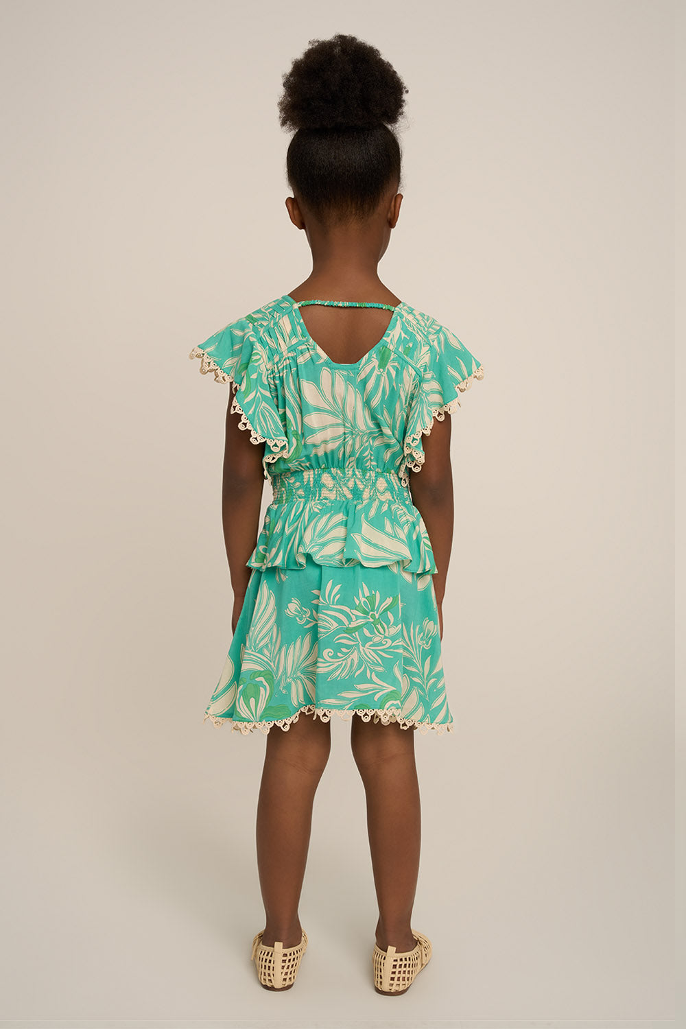 Back view of Poupette St Barth Mini Dress Noemi for girls in aqua Kerylos fabric, featuring a lightweight, stylish design.