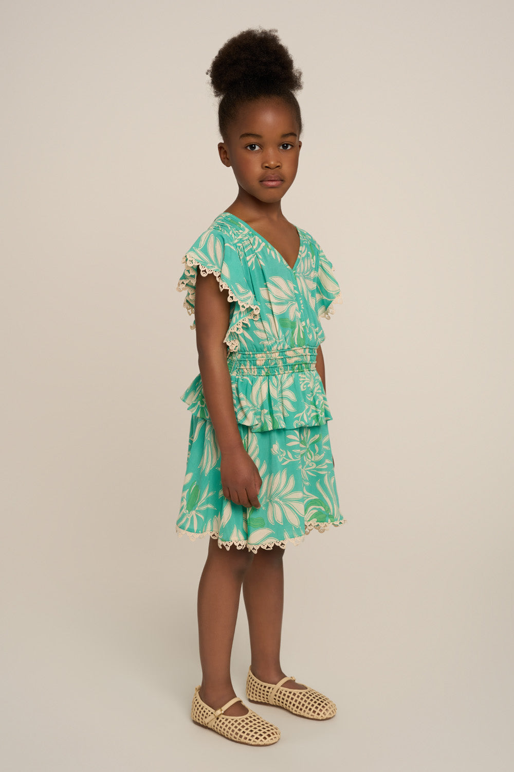 Girls' Mini Dress Noemi in Aqua Kerylos by Poupette St Barth, showing side view with playful, lightweight fabric and vibrant color.