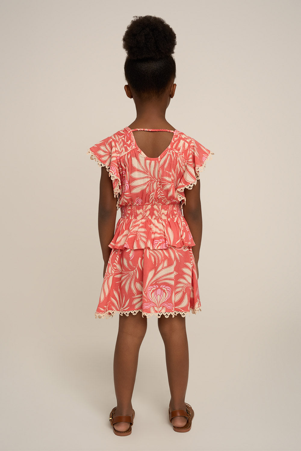 Pink Mini Dress Noemi for girls by Poupette St Barth, shown from the back with ruffled details and soft fabric.