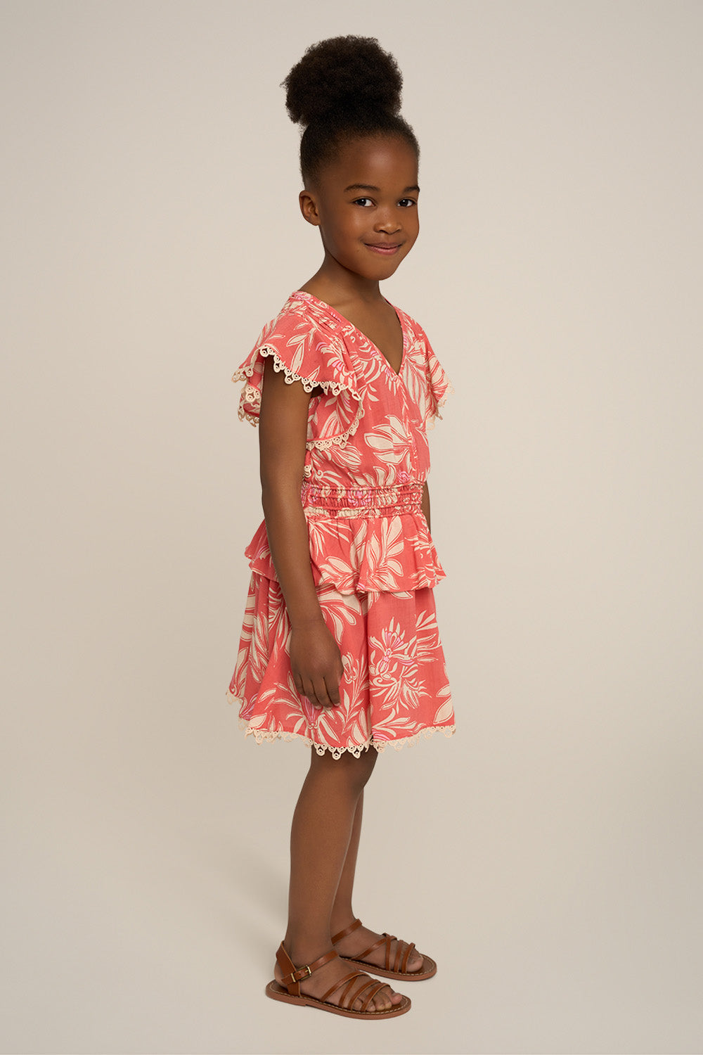 Pink Poupette St Barth Noemi mini dress for girls, side view showing lightweight fabric and stylish design.