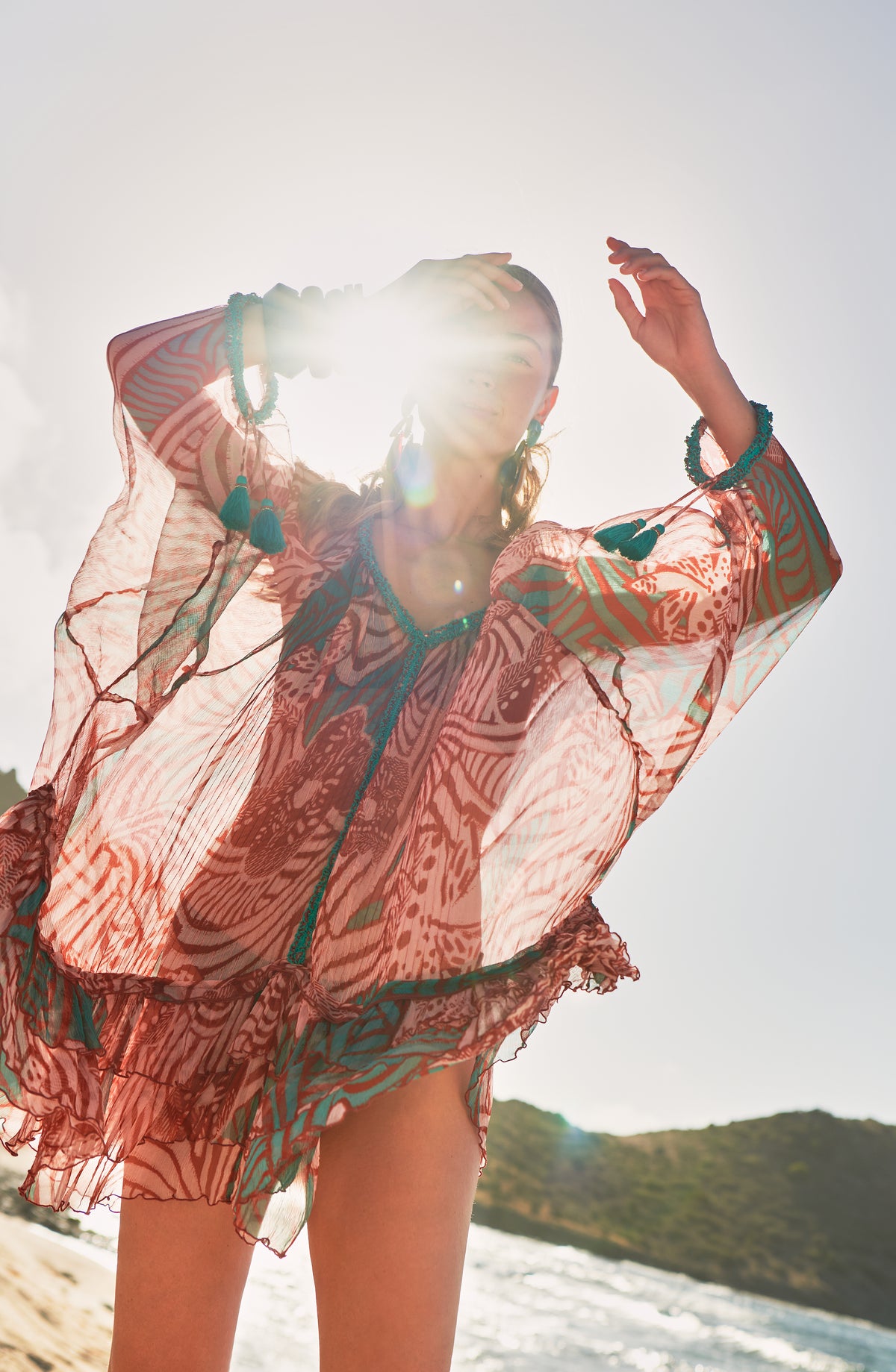 Brick Japonism poncho – Poncho Nava by Poupette St Barth, worn on the beach in the sun