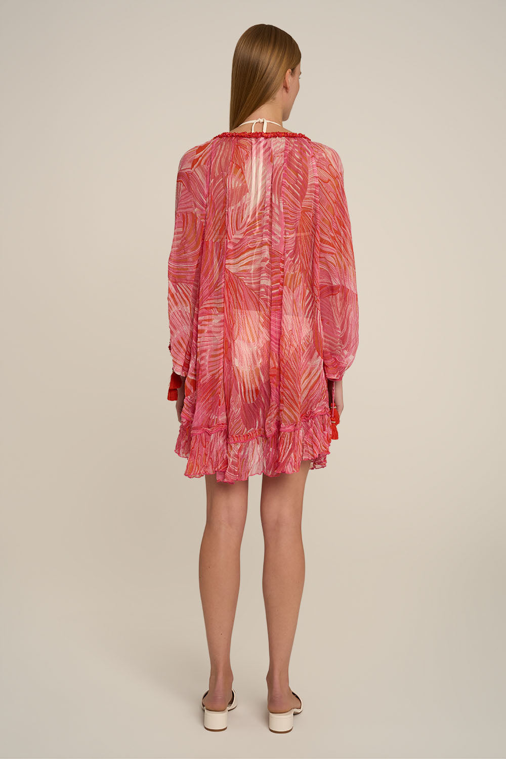 Pink Nava Poncho by Poupette St Barth featuring soft fabric and relaxed fit, shown from the back.