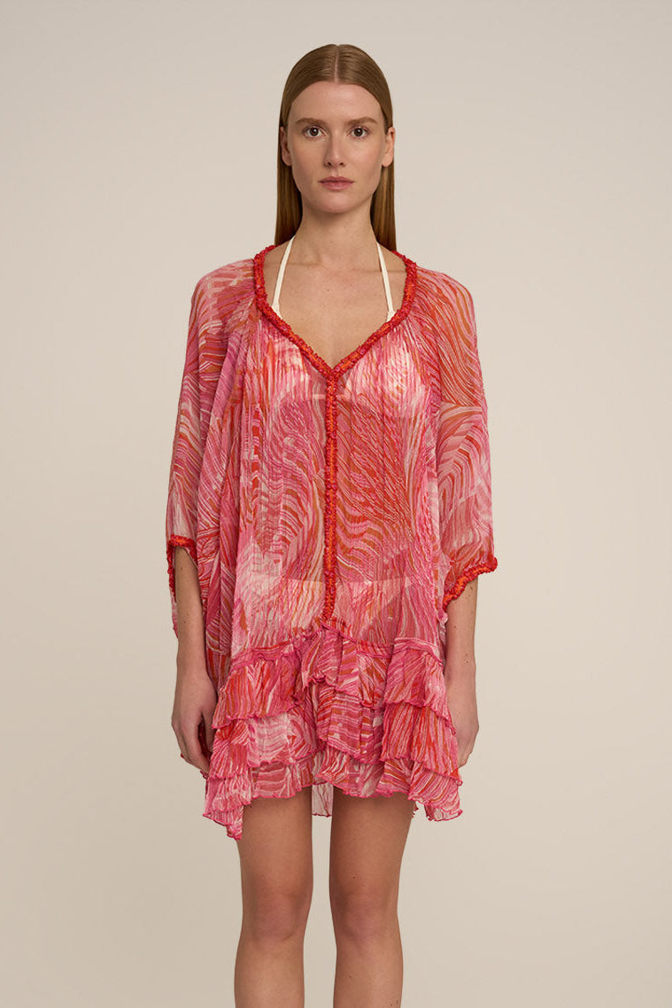 Pink Nava Poncho by Poupette St Barth featuring a flowy design and soft fabric, displayed from the front view.