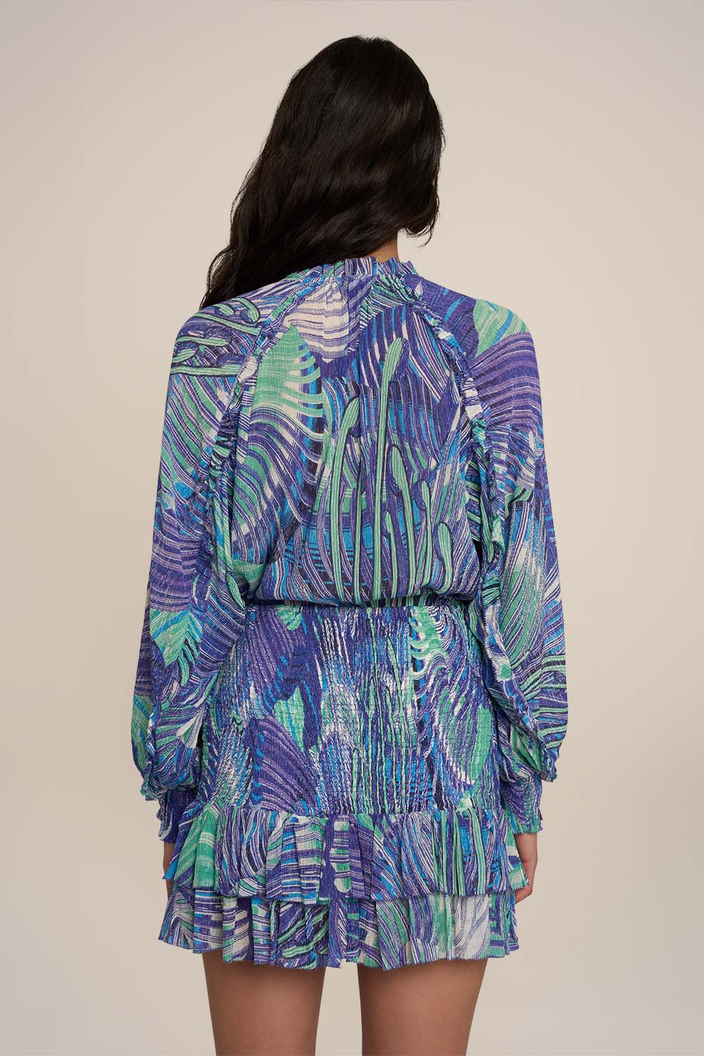 Blue Adeline shirt by Poupette St Barth, stylish top with a relaxed fit, shown from the back with a mini skirt in the image.