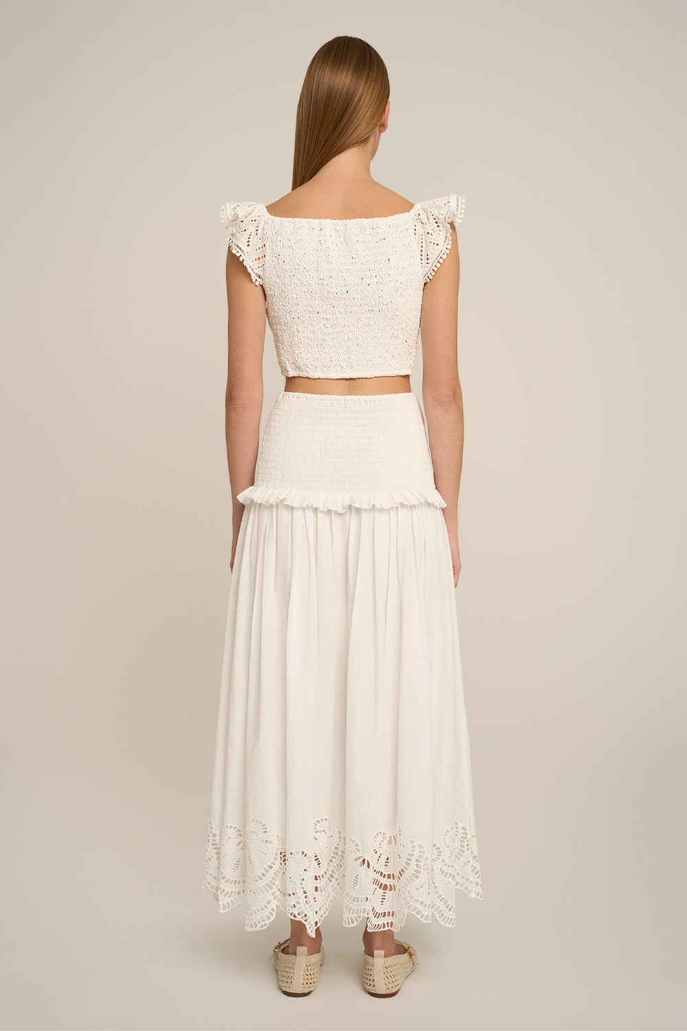 Long Fiona skirt in natural white by Poupette St Barth, shown from the back with a flowing, elegant design.