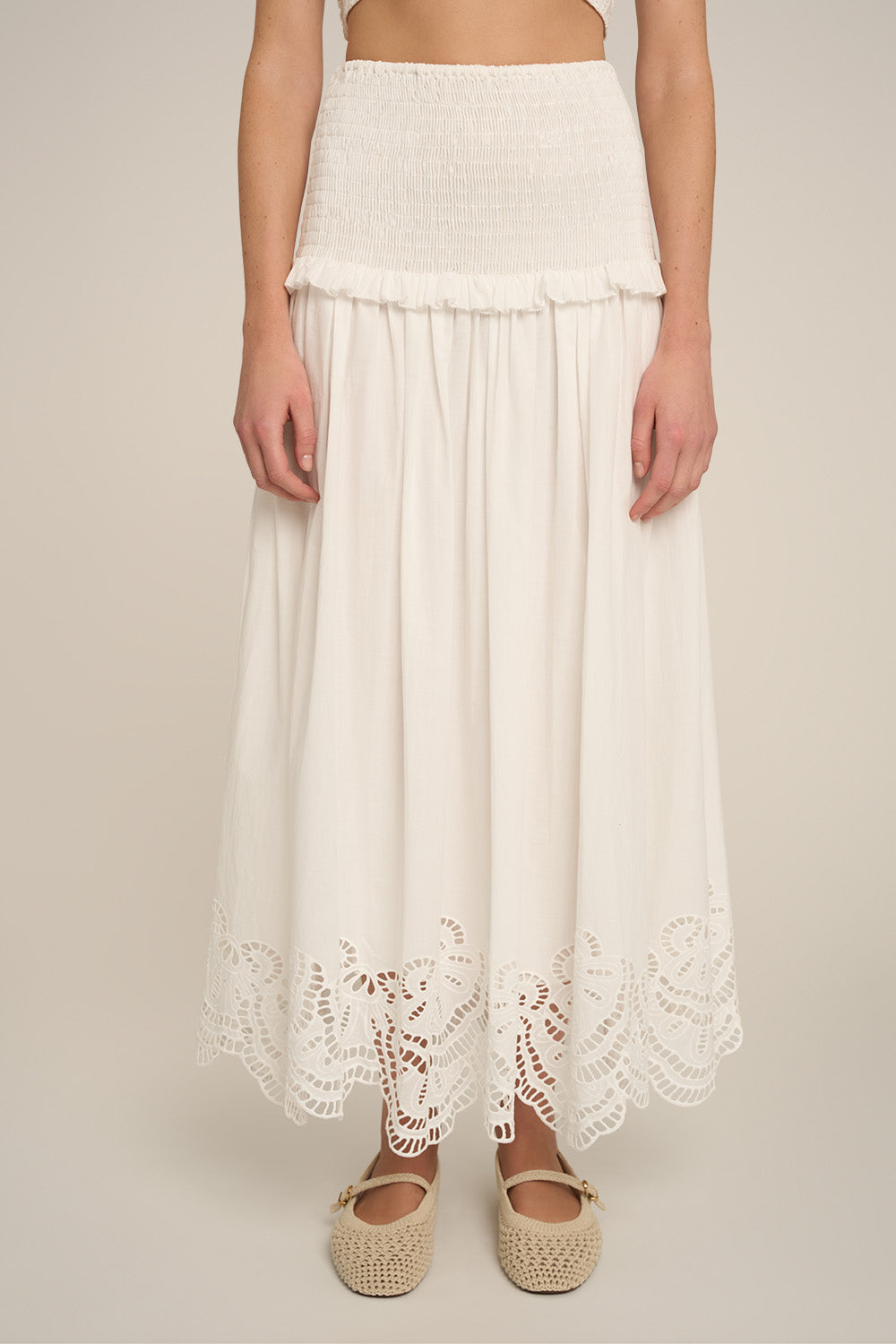 Long Fiona skirt in natural white by Poupette St Barth, flowing fabric, waist detail, and elegant design.