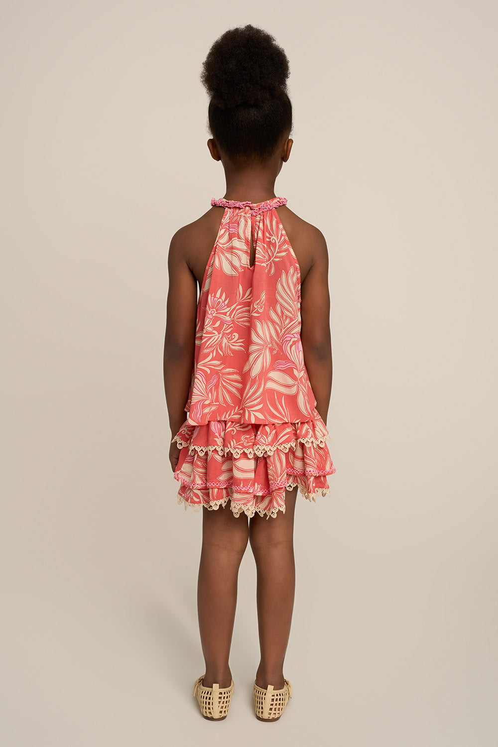 Pink Cleo girls' top by Poupette St Barth, stylish shirt with ruffle details, shown from the back.