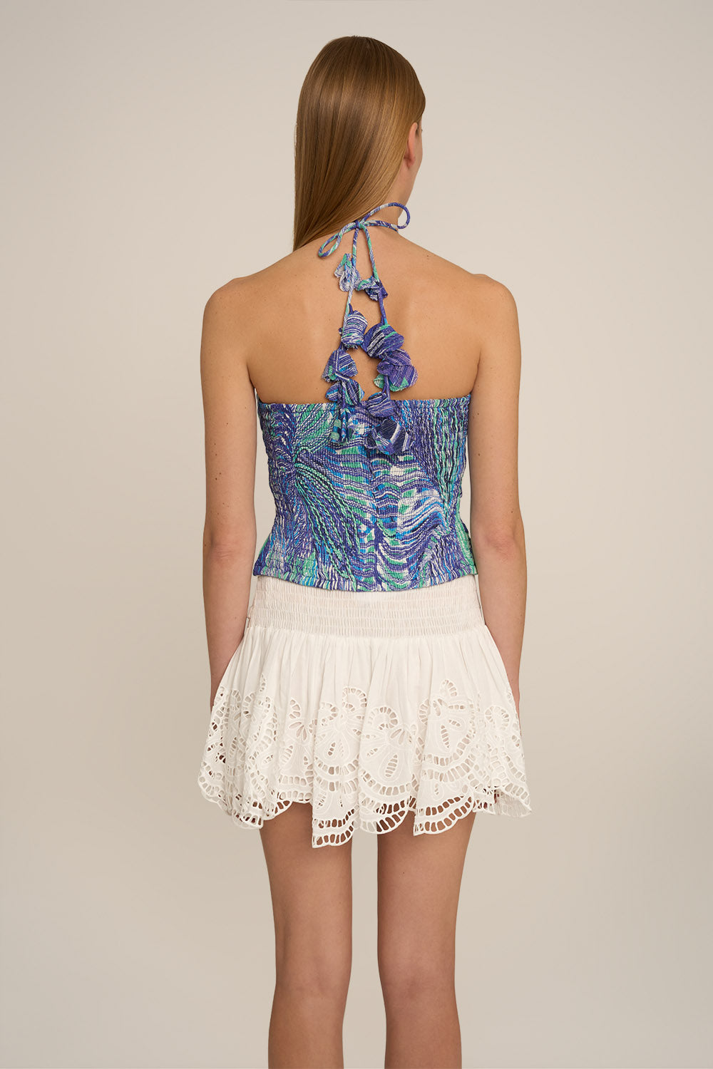 Blue Tessa top by Poupette St Barth, stylish shirt with a relaxed fit and subtle design, shown from the back.