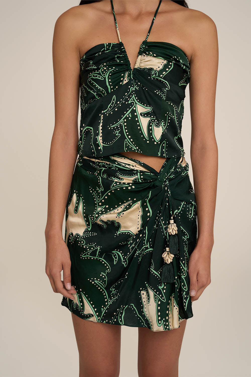 Green Tilda mini skirt by Poupette St Barth featuring a stylish design, shown on a model against a neutral background.
