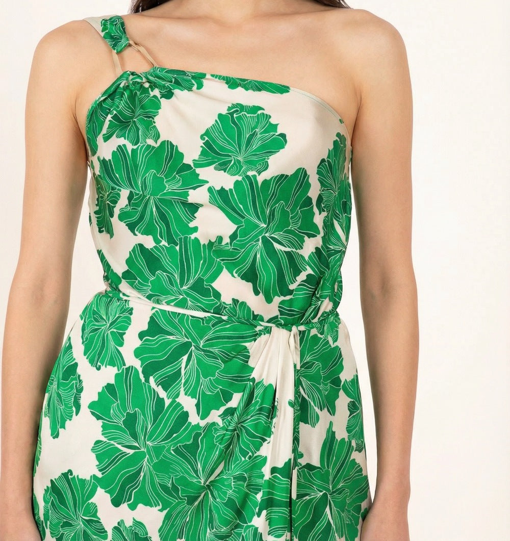 Green floral long dress by Poupette St Barth featuring satin fabric and a flowing silhouette, styled with a relaxed fit.