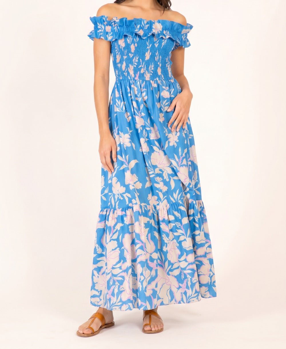 Blue cotton long dress Suzanne by Poupette St Barth with a flowing silhouette and palm beach print.