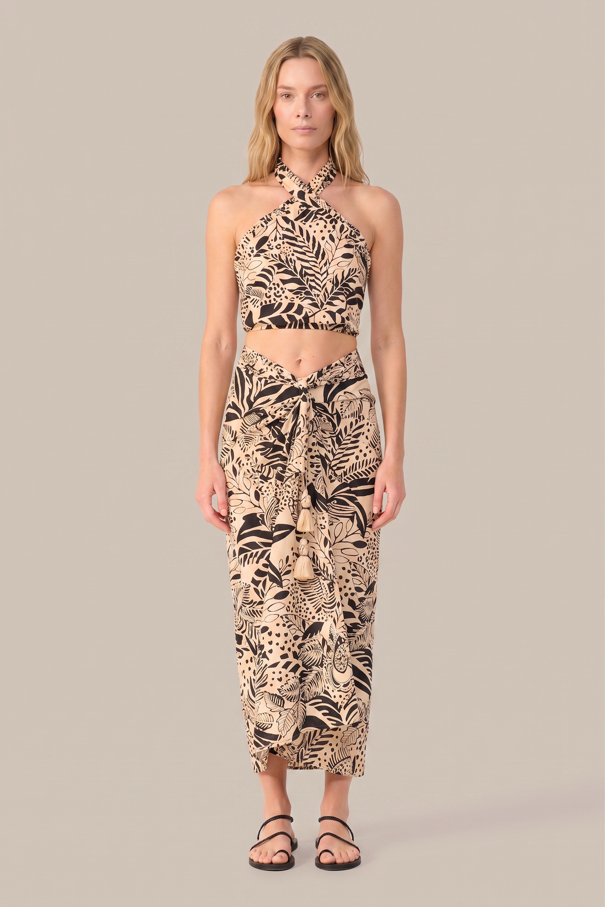 Black Uma long skirt by Poupette St Barth featuring a Toucan print, flowing design, and lightweight fabric.