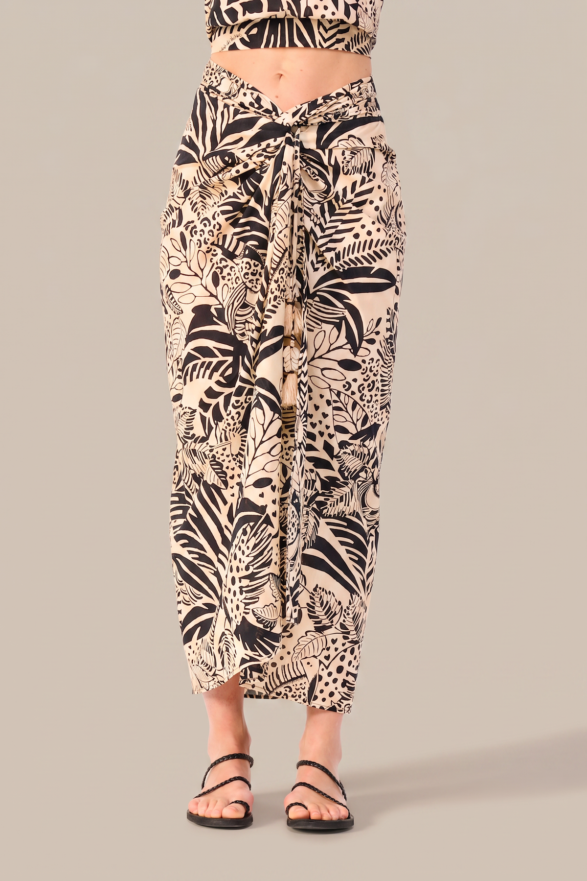 Long black Uma skirt with toucan print from Poupette St Barth, featuring a flowing design and tropical-inspired pattern.