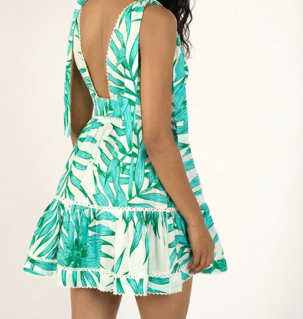 Green palm leaf cotton mini dress by Poupette St Barth, lightweight and stylish for warm weather.