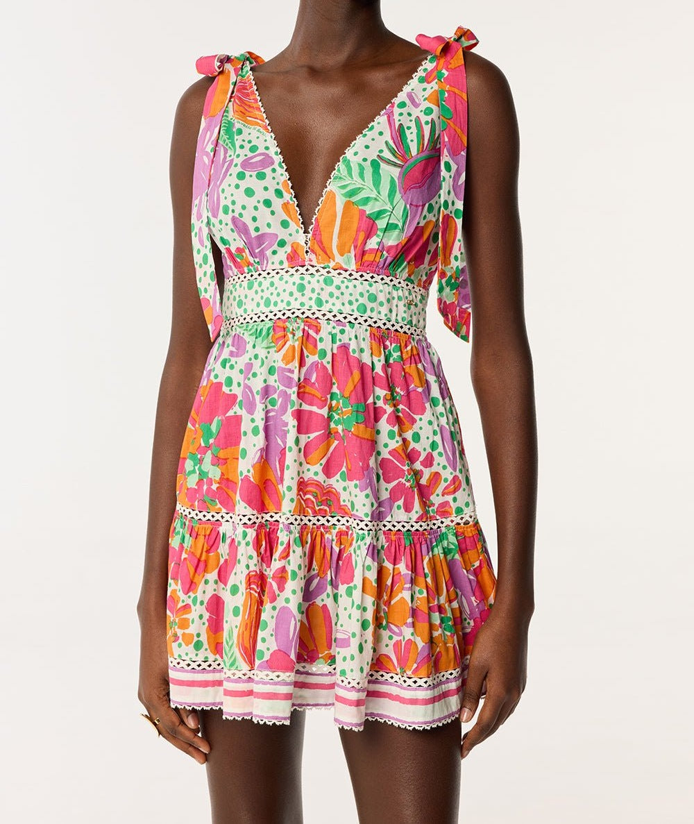 Poupette St Barth Mini Dress Cara in pink cotton with an artistic floral print, short-sleeve, casual summer style.