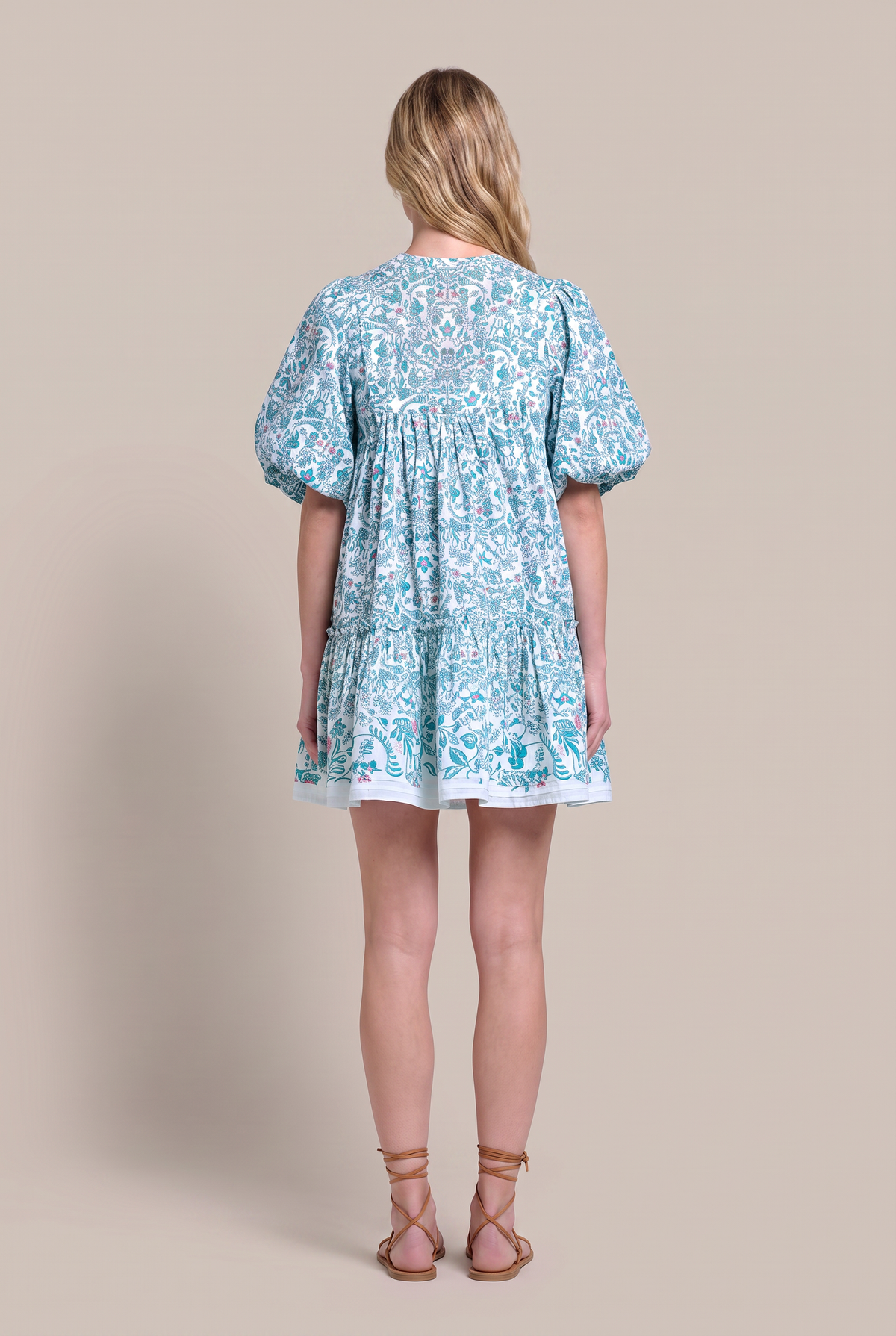 Green Mini Dress Cruz by Poupette St Barth, showcasing a stylish, fitted mini dress with a vibrant floral pattern and delicate straps.