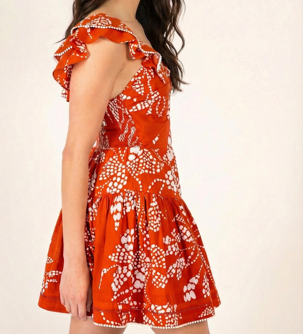 Poupette St Barth Mini Dress Niki in Paprika Austral, lightweight cotton, sleeveless with a relaxed fit, vibrant orange color.