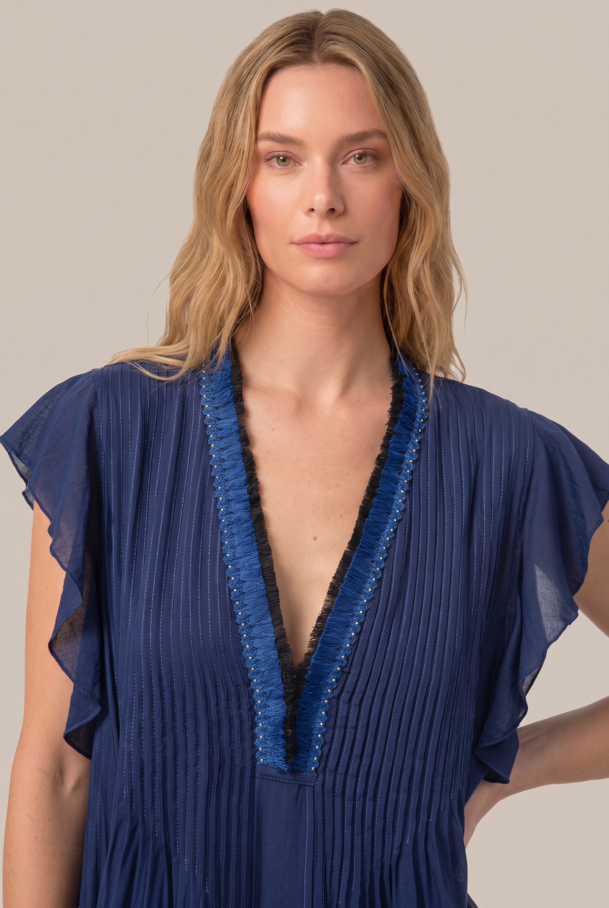 Navy Mini Dress Sasha by Poupette St Barth displayed on a hanger, featuring lightweight fabric and short sleeves.