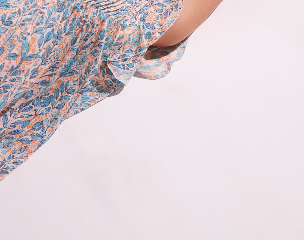 Poupette St Barth Mini Dress Sasha in vibrant orange feuille viscose, sleeveless with a relaxed fit, perfect for warm weather.