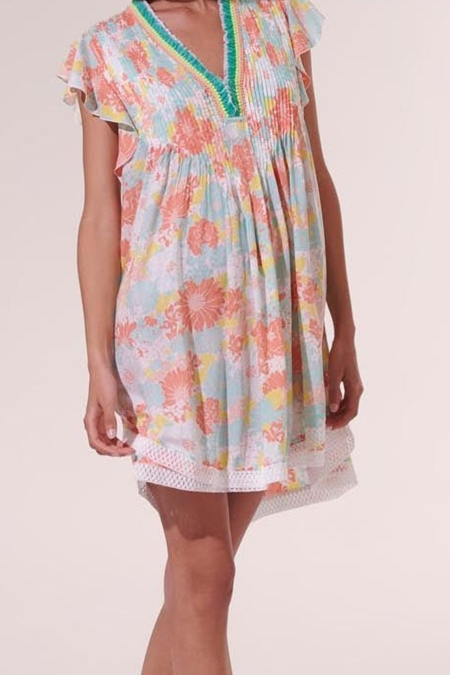 Poupette St Barth Mini Dress Sasha in orange flower print, lightweight viscose fabric, short sleeveless design with vibrant floral pattern.