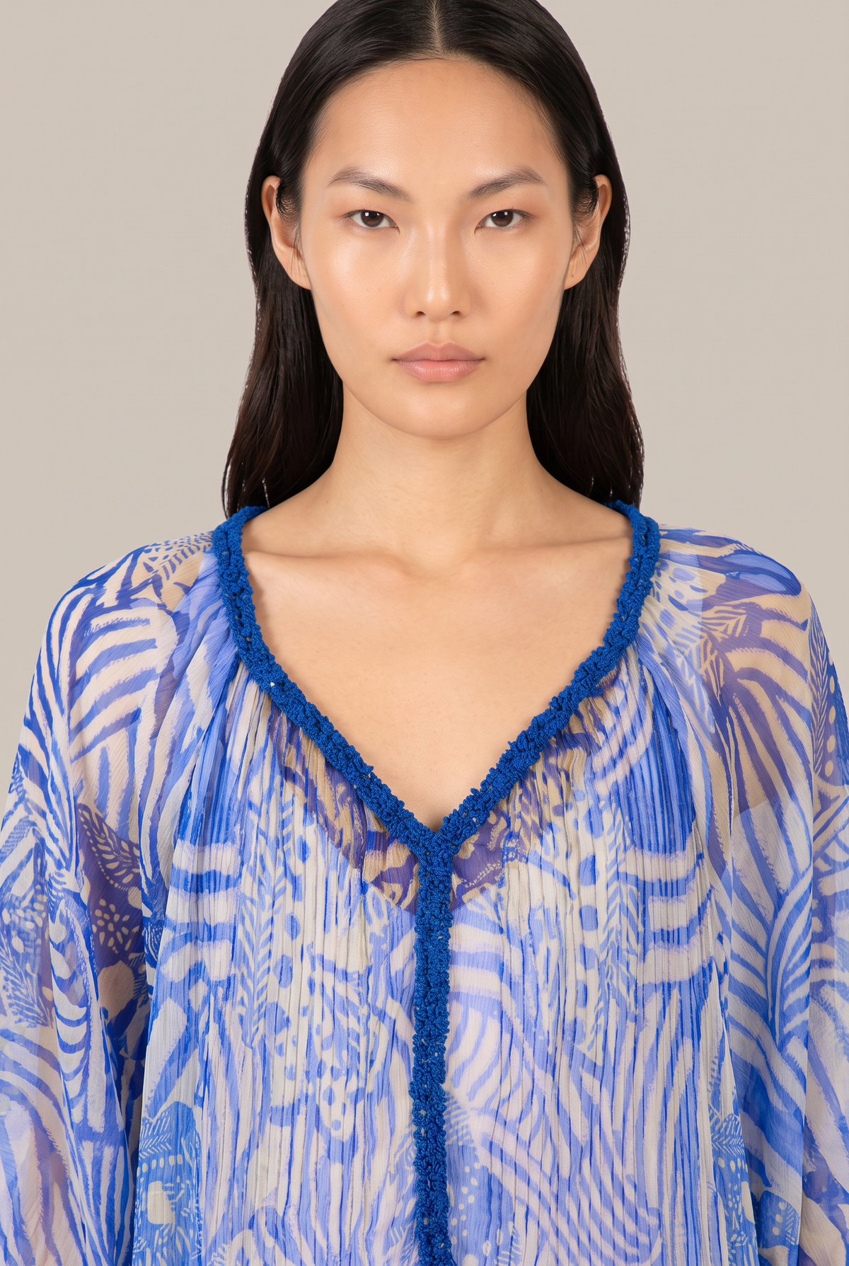 Blue Japonism poncho – Poncho Nava by Poupette St Barth, close-up of the beaded V-neckline