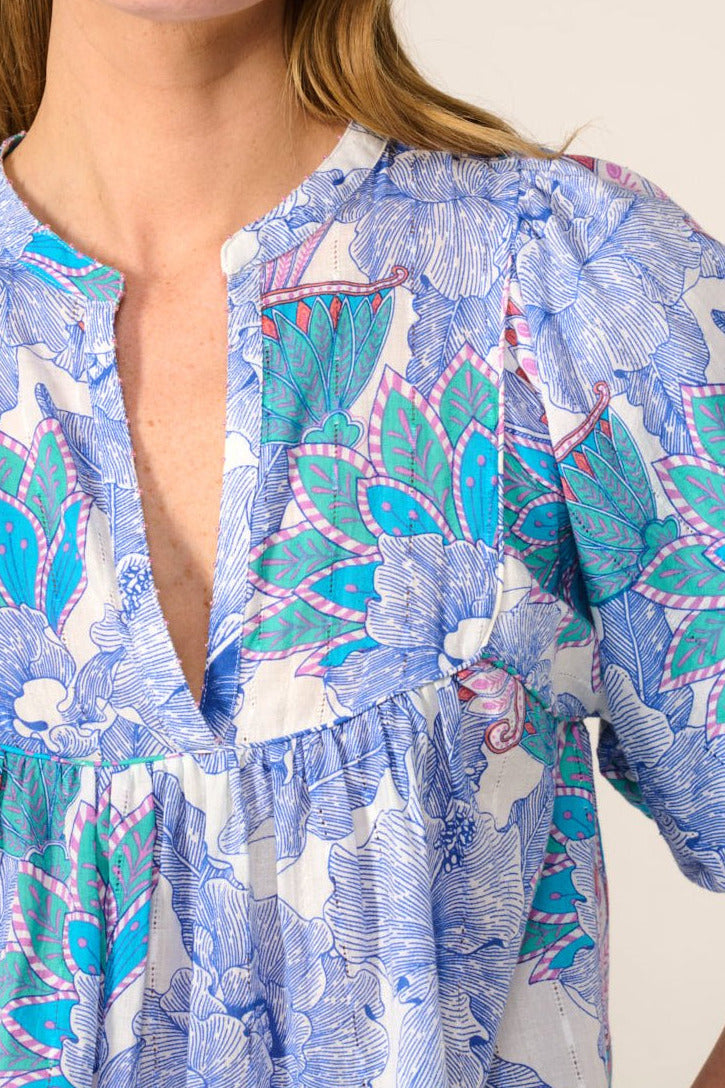 Blue cotton eyelet stripe blouse from Poupette St Barth's Blouse Flores - Blue Padang collection, featuring a lightweight and stylish design.