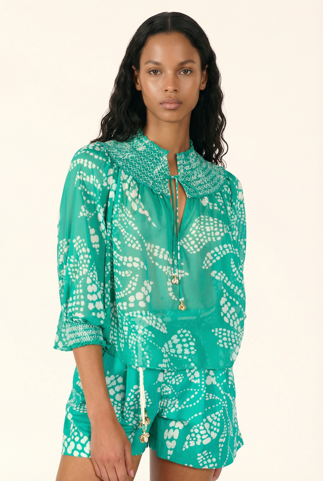 Mint green Ysee blouse by Poupette St Barth featuring a relaxed fit and lightweight fabric, displayed on a hanger.