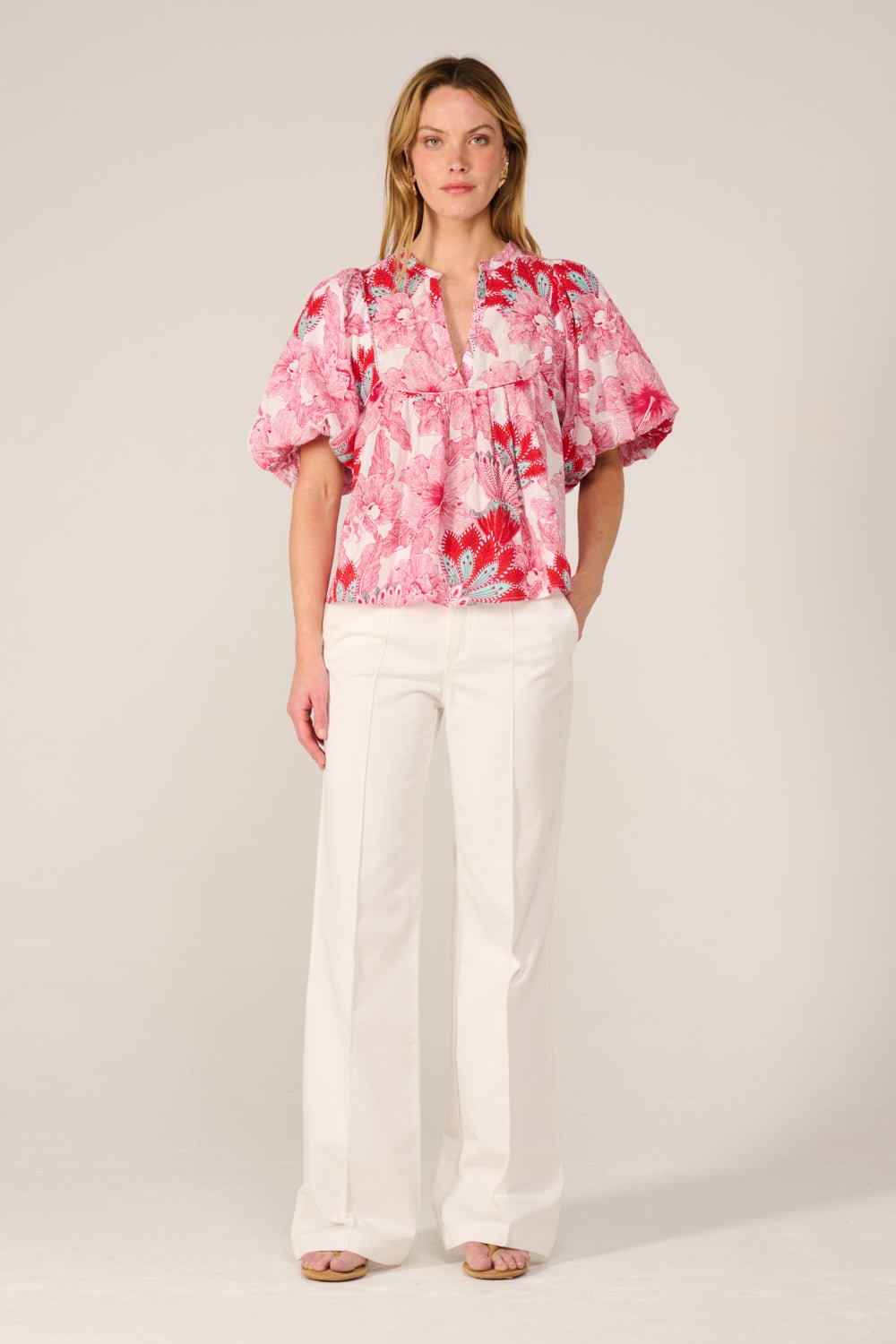 Pink floral blouse from Poupette St Barth, featuring a stylish design and lightweight fabric, perfect for casual or dressy wear.