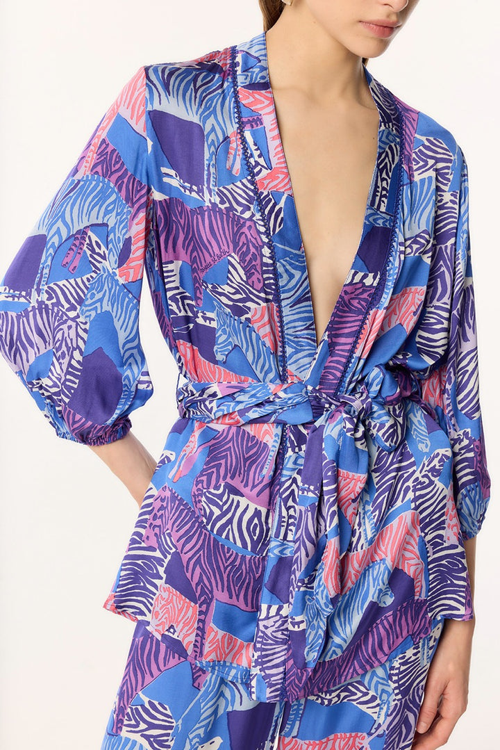 Blue Celie jacket by Poupette St Barth, featuring lightweight fabric and stylish design, shown on a model.