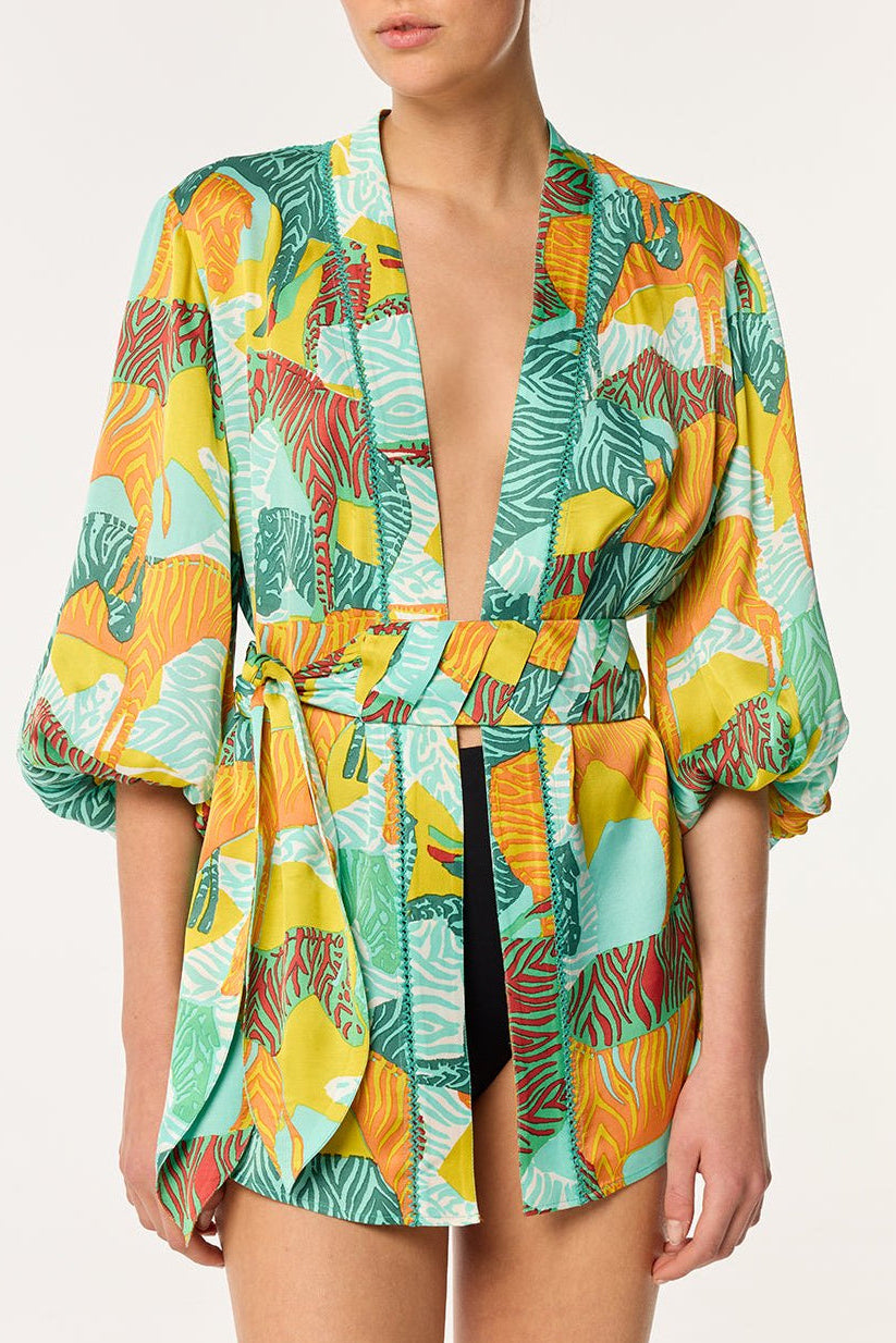Mint green Poupette St Barth Celie jacket with a relaxed fit and stylish design, shown on a hanger against a neutral background.
